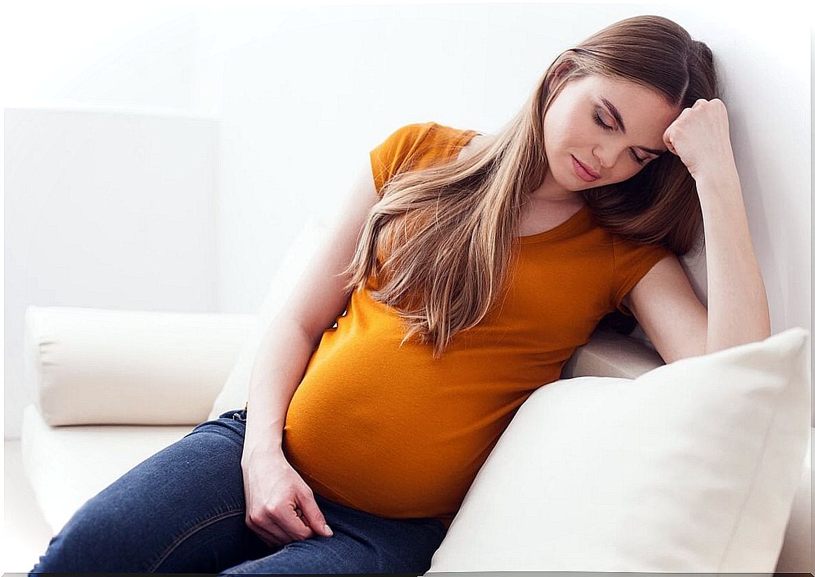 Woman suffering changes in emotions during pregnancy.