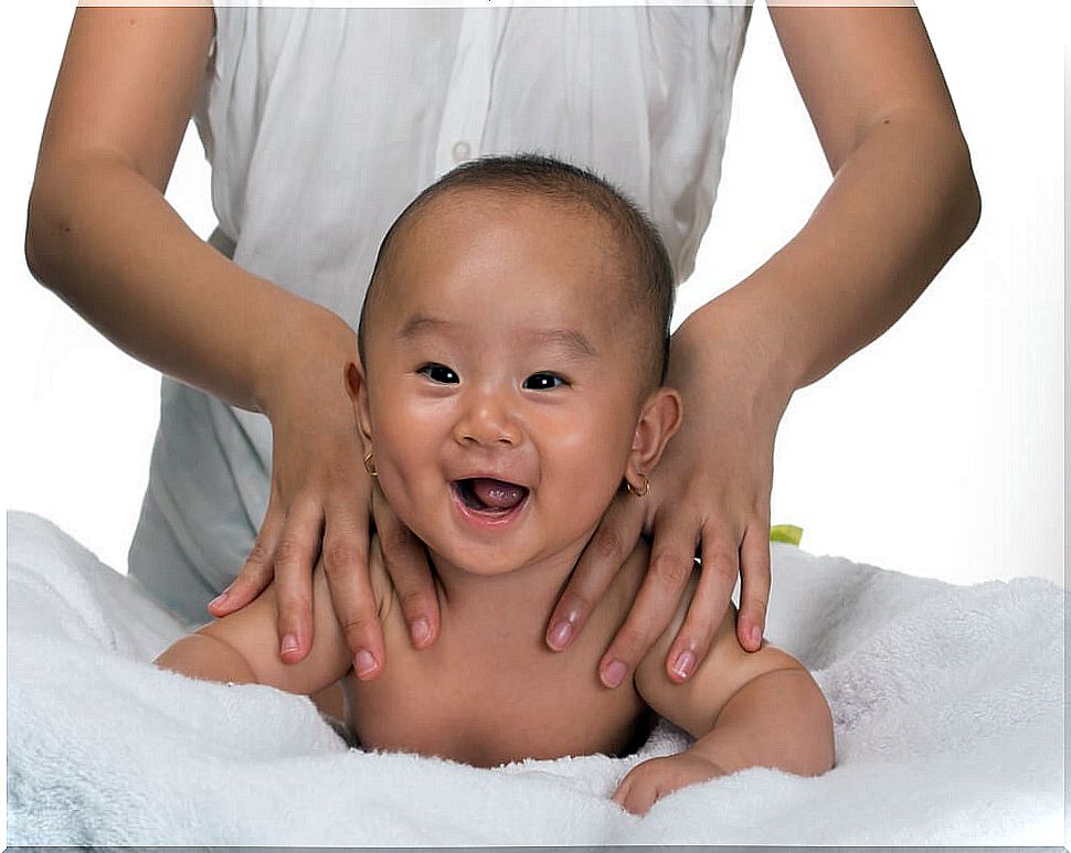 Baby getting a massage to relieve constipation in babies.