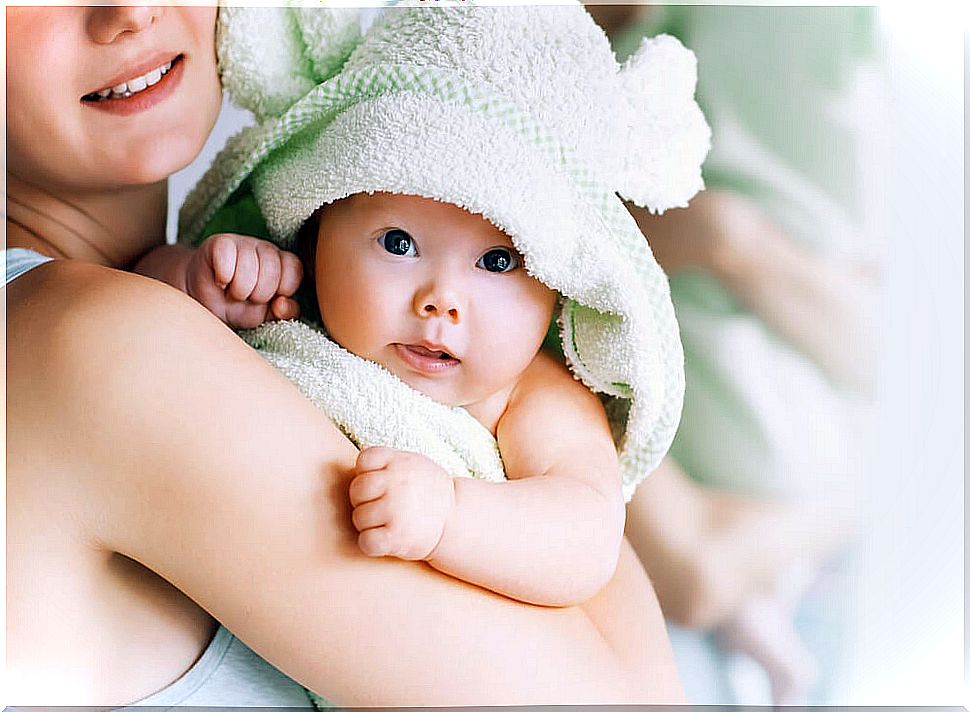 Mother bathing her baby.