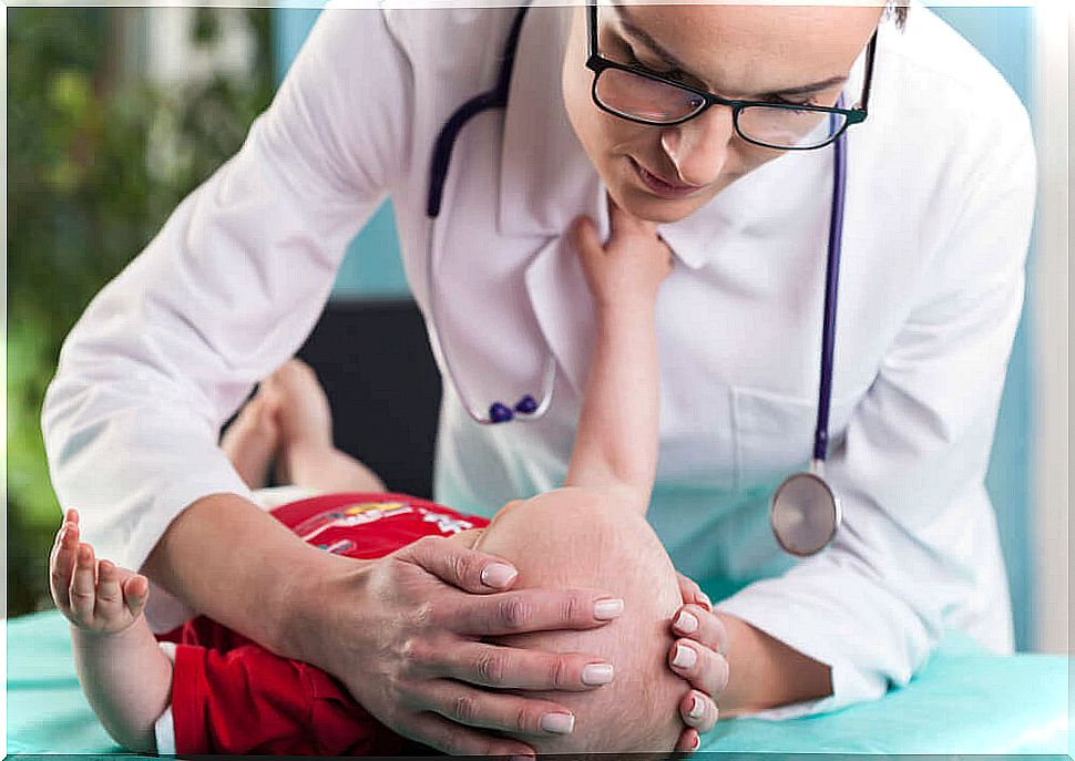 Doctor observing a baby