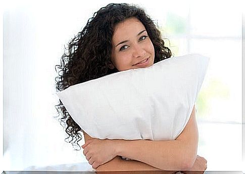 woman hugging pillow